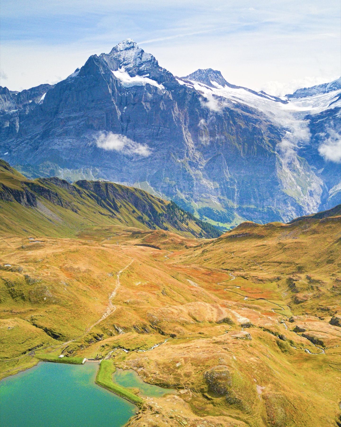 A snow-capped peak above an alpine lake